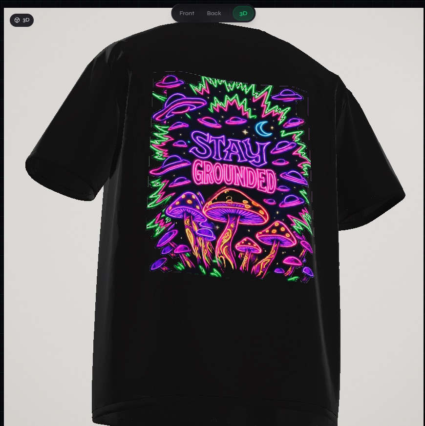 A black oversized tee rendered in the Crayonz studio's 3D preview, with a neon mushroom 'Stay Grounded' graphic on the back.